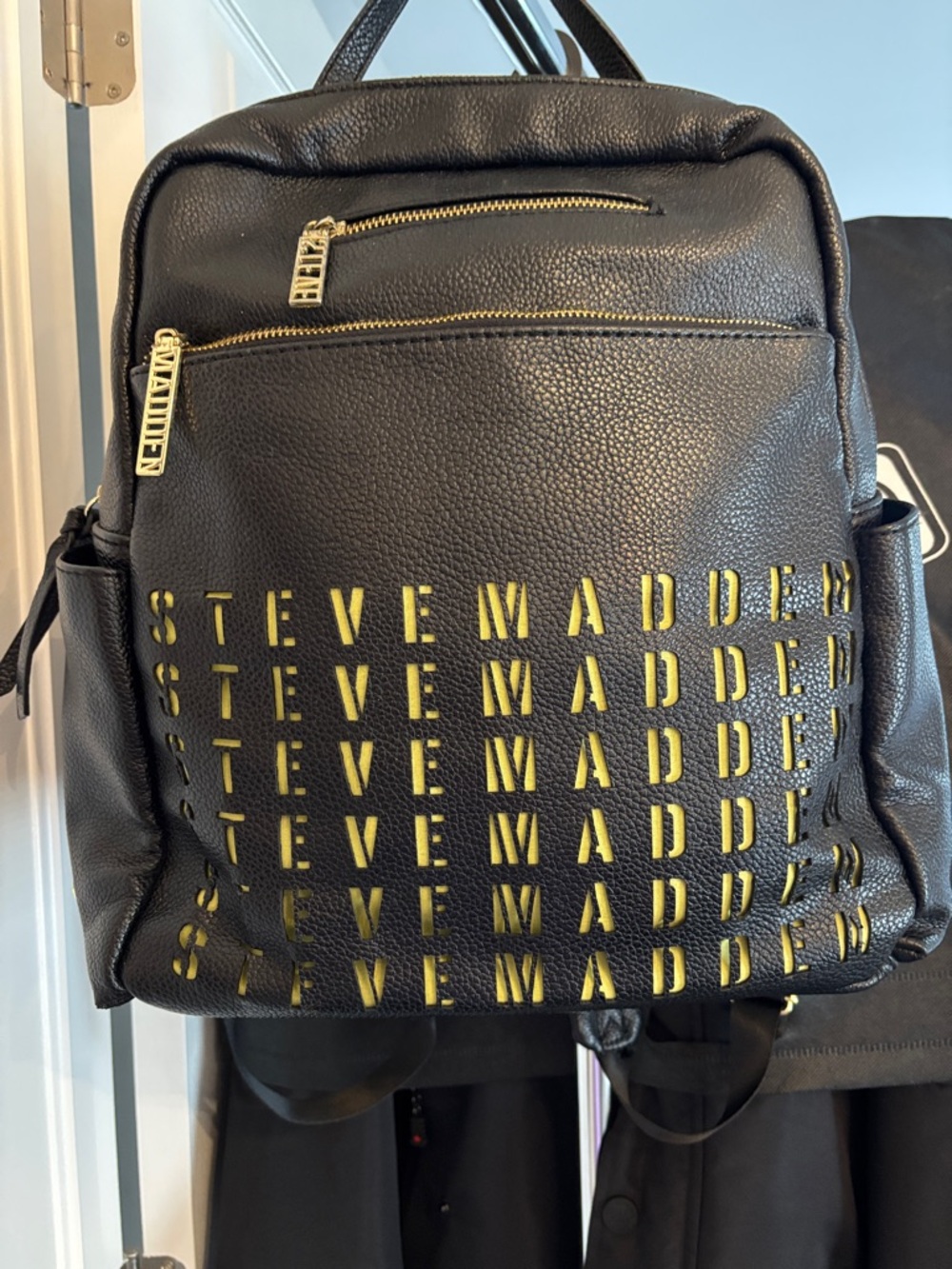 Steve Madden Black Backpack with Gold and Yellow Logo Cutouts